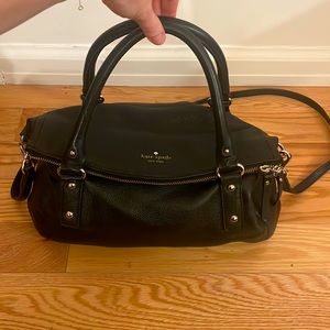 Black, leather, Kate Spade purse. Gold hardware. Long, crossbody strap included.